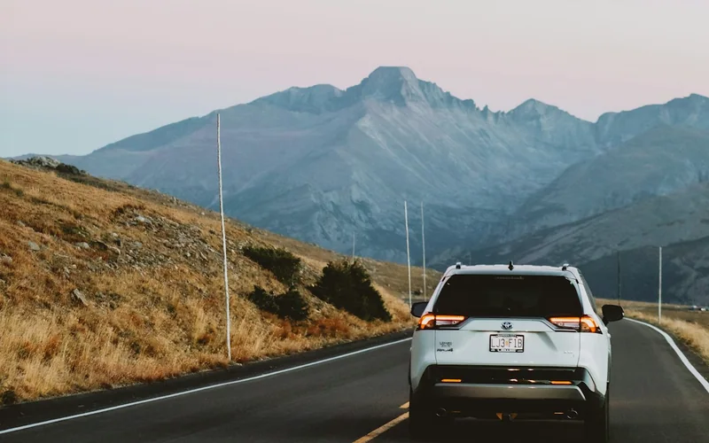 SUV traveling toward the mountains