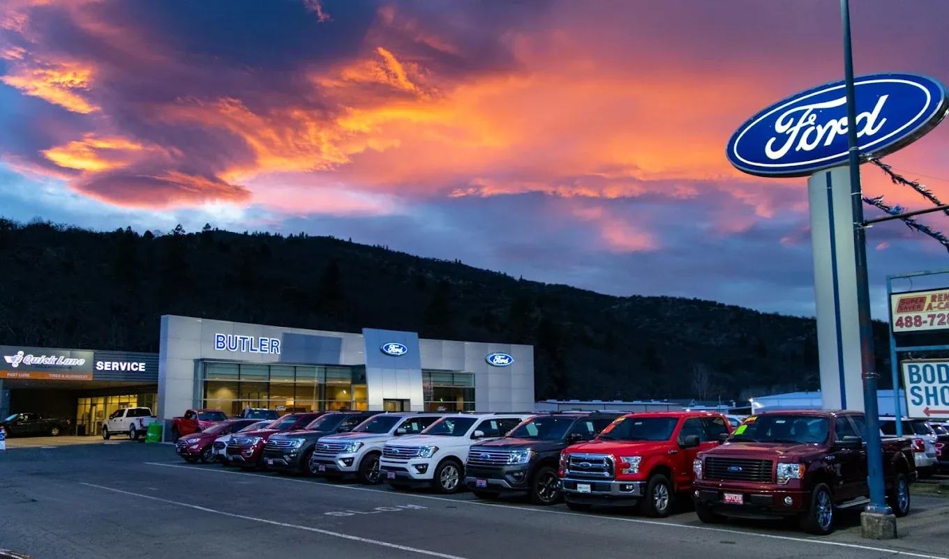 Butler Ford dealership and vehicle lot at sunset in Ashland, Oregon