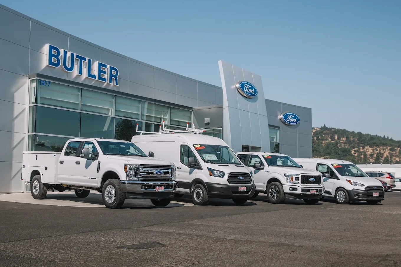 Ford commercial trucks and vans outside Butler Ford